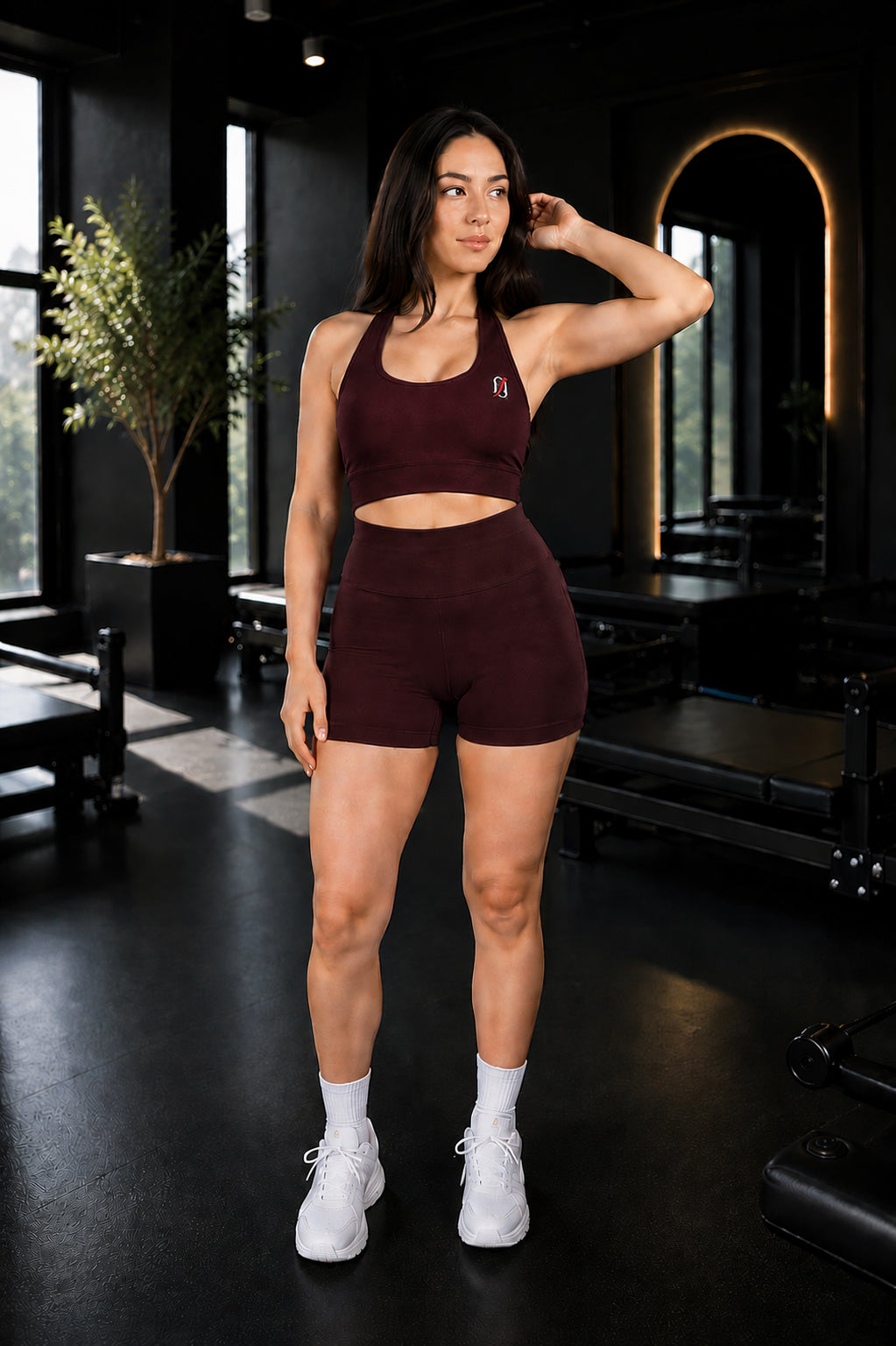 1off women's wine workout top and shorts set in a gym